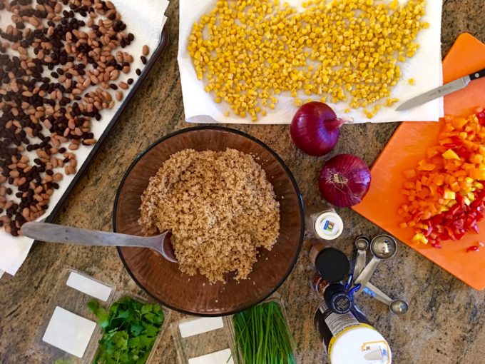 Southwest Quinoa Salad ingredients- quinoa, corn, red pepper, chives, cilantro, beans, black beans, bell pepper, peppers