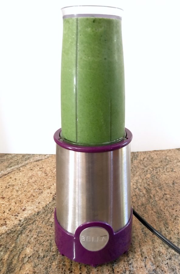 Green smoothie in a mini blender