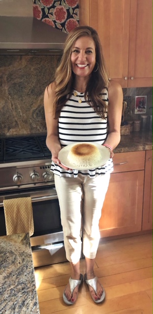 Bita holding a dish of Persian steamed rice with crispy tahdig