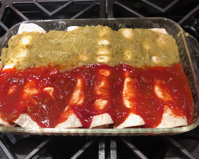 Enchiladas with red and green sauce or salsa