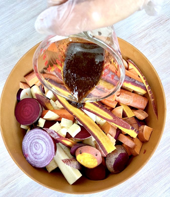 Root vegetables in a bowl with dressing