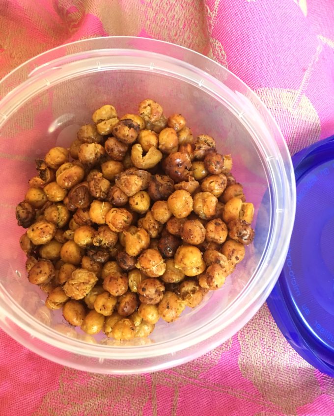 roasted garbanzo beans in a plastic storage container