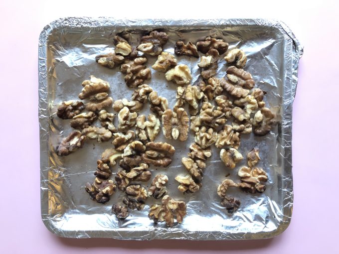 toasting walnuts in a baking tray