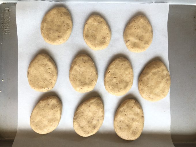 shaping Persian Tea Cookie cookies on parchment paper