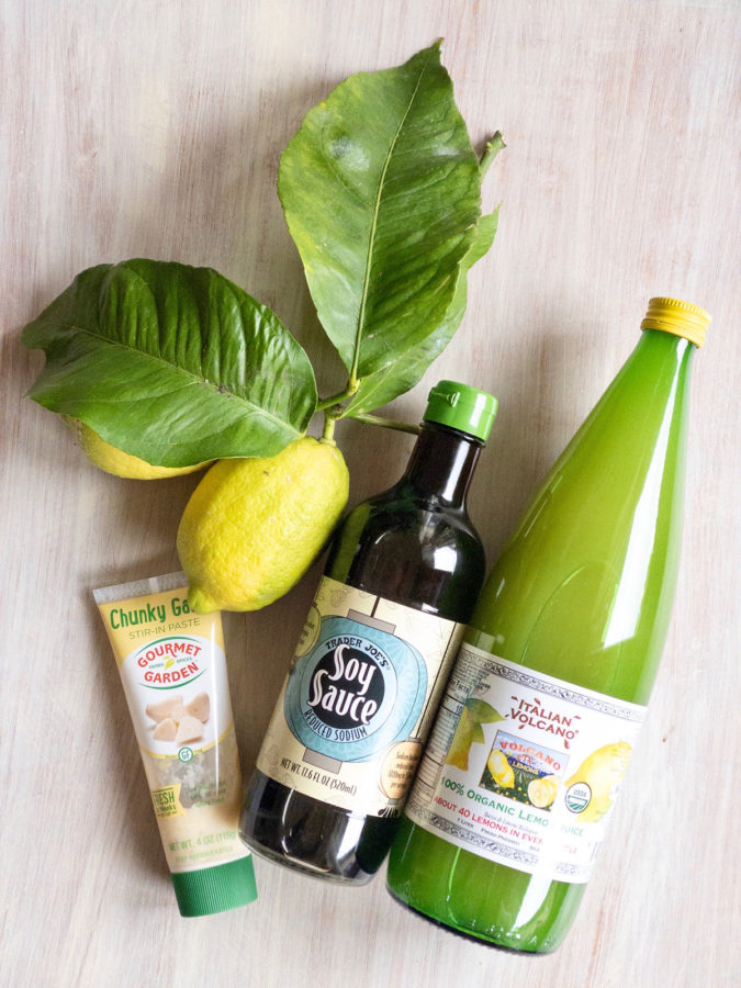 Ingredients for paleo flank steak marinade. Fresh lemons, soy sauce (please not that to make this a true paleo recipe use coconut aminos as a substitute for the soy sauce!), lemon juice and minced garlic.