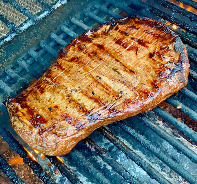 Marinated flank steak on an electric grill