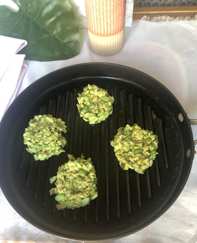Edamame cake batter cooking on an indoor grill pan