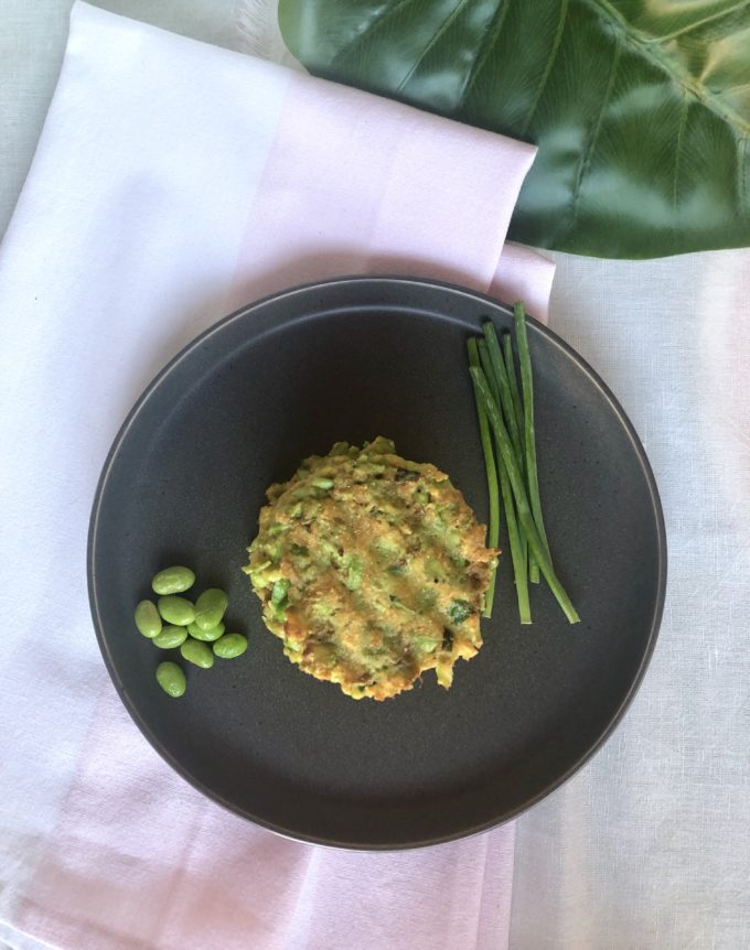 Edamame cake served with fresh soy beans and chives