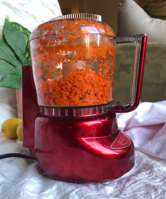 Grating carrots in a Cuisinart