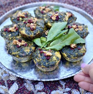 KooKoo Sabzi Muffins plated with fresh herbs