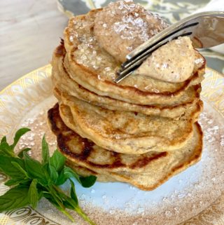 Forkful of Jamaican Banana Fritter Pancakes stacked up high