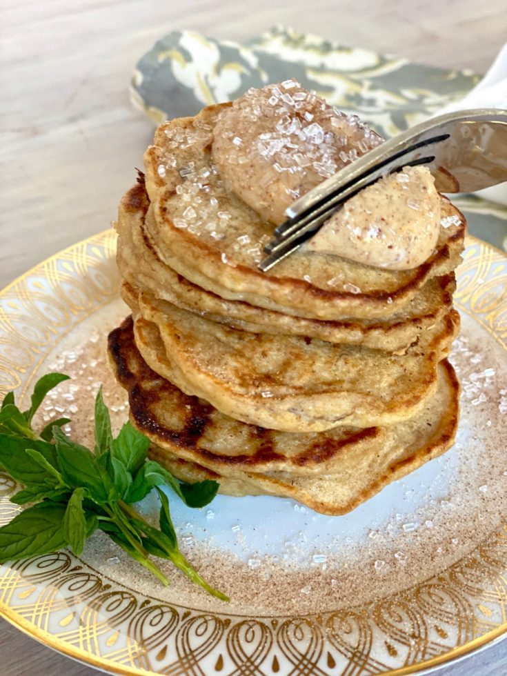 Forkful of Jamaican Banana Fritter Pancakes stacked up high