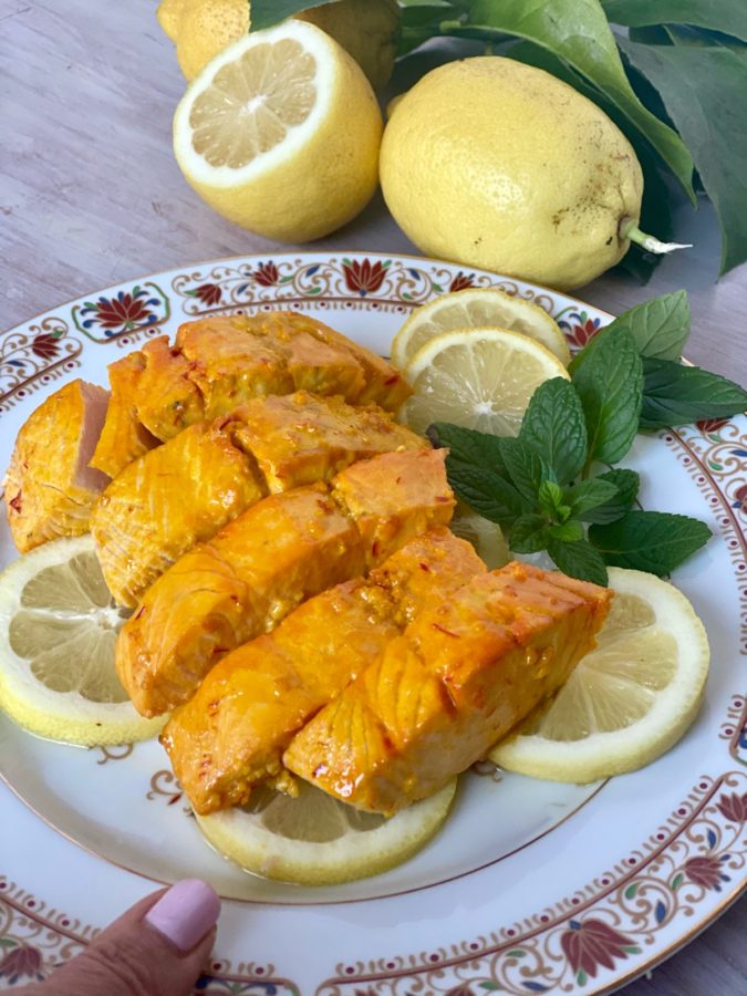 Serving Oven Baked Easy Marinated Salmon infused with a citrus saffron oil