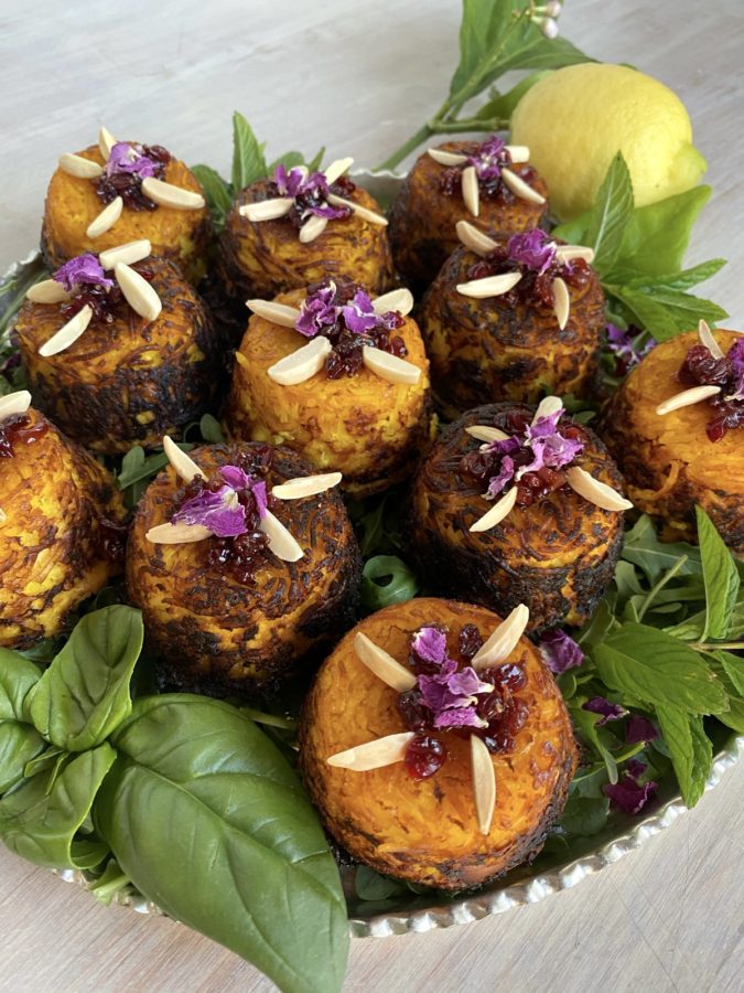 Tahchin Persian Crispy Rice Cups Made in a Muffin or Cupcake tin garnished with barberries zereshk slivered almonds and culinary rose petals