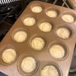 Yazdi cupcake batter in a muffin tin tray