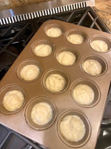 Yazdi cupcake batter in a muffin tin tray